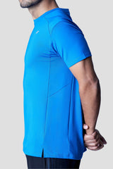 Side view of a man in a blue recycled polyester activewear tee highlighting the design details.