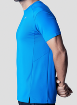 Man wearing a blue active t-shirt showing the tee side design on a plain background