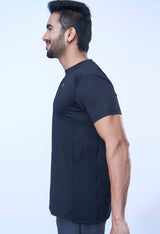 Side view of a man in a black recycled polyester activewear tee highlighting the design details.