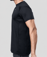 Man wearing a black active t-shirt showing side tee design on a light gray background